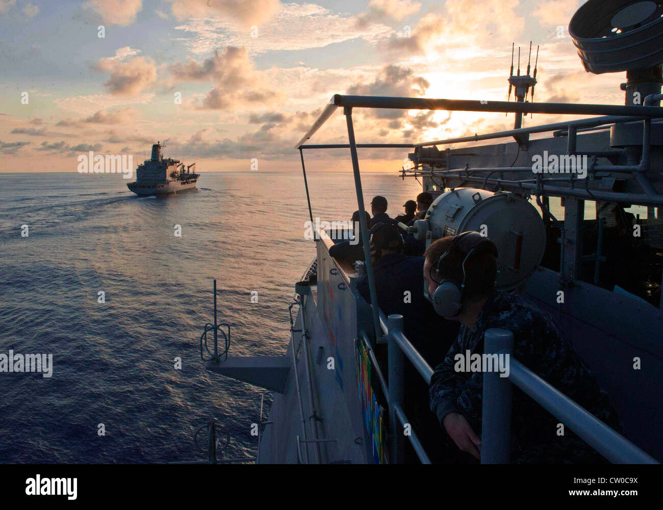 The Ticonderoga-class guided-missile cruiser USS Cape St. George (CG 71) approaches the Military Sealift Command fleet replenishment oiler USNS Guadalupe (T-AO 200) for a replenishment-at-sea. Cape St. George is deployed as part of Carrier Strike Group (CSG) 9, which is operating in the U.S. 6th Fleet area of responsibility in support of maritime security operations and theater security cooperation efforts. Stock Photo