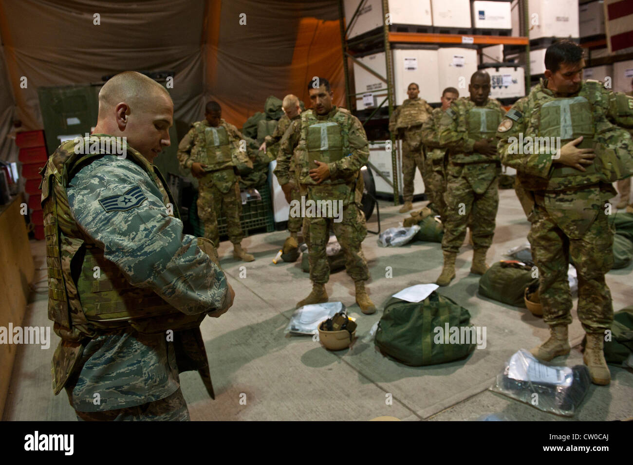 Staff Sgt. Seth Tuggle demonstrates how to properly wear a tactical