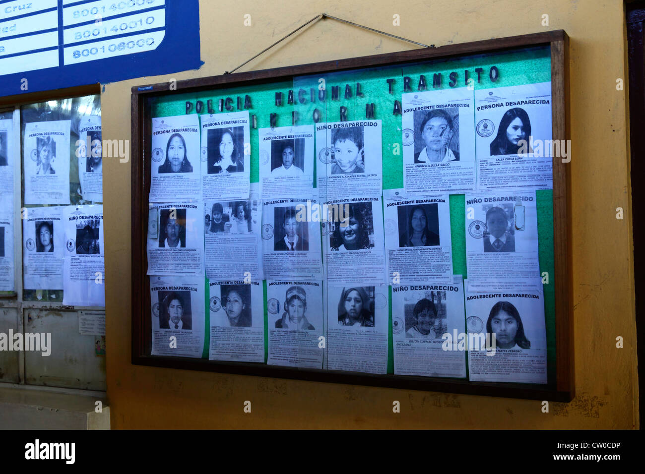Posters with pictures of missing children outside the National Transit Police office in main bus station, La Paz, Bolivia Stock Photo