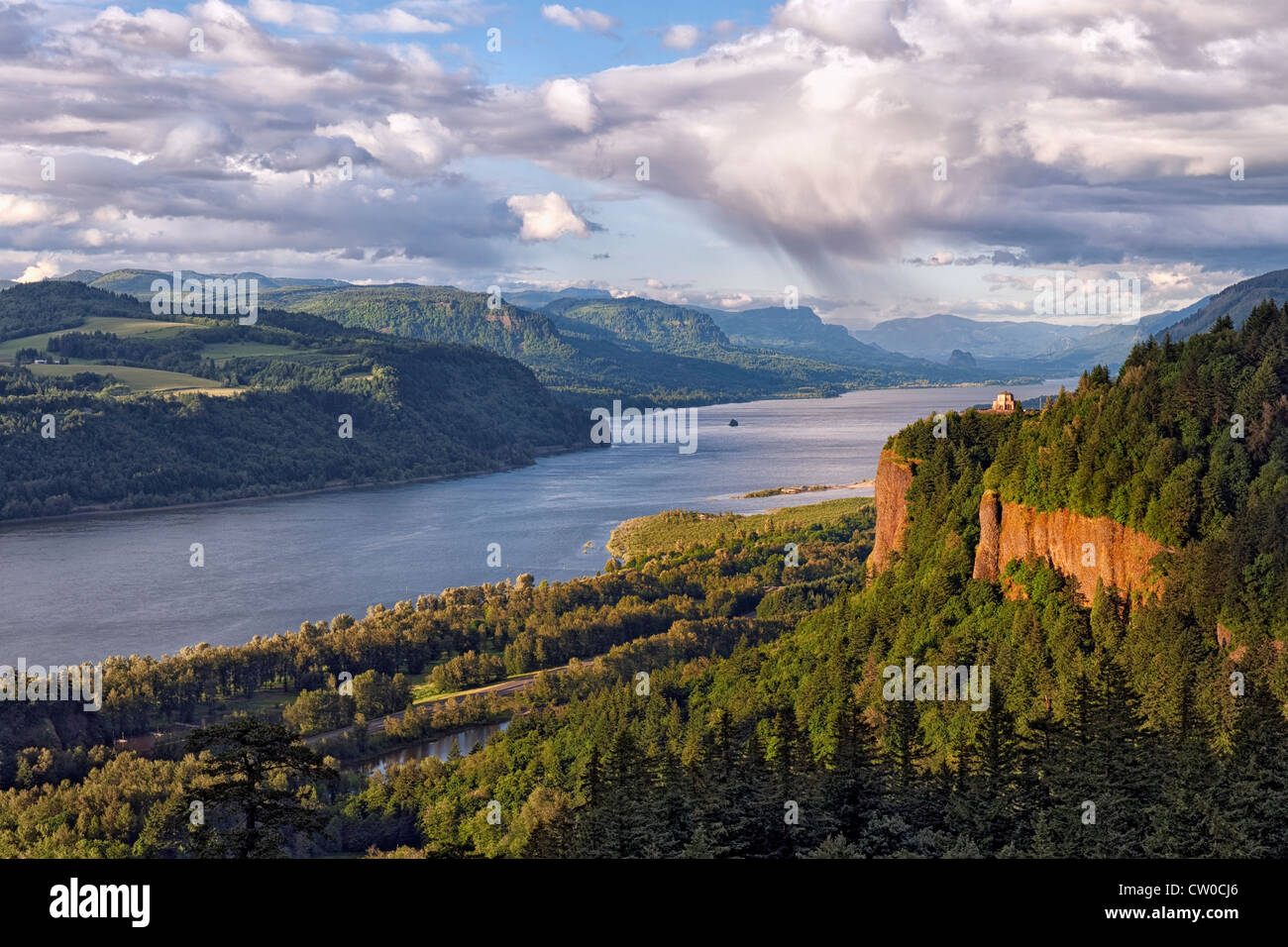 Evening light bathes Oregon’s Crown Point as a band of showers passes
