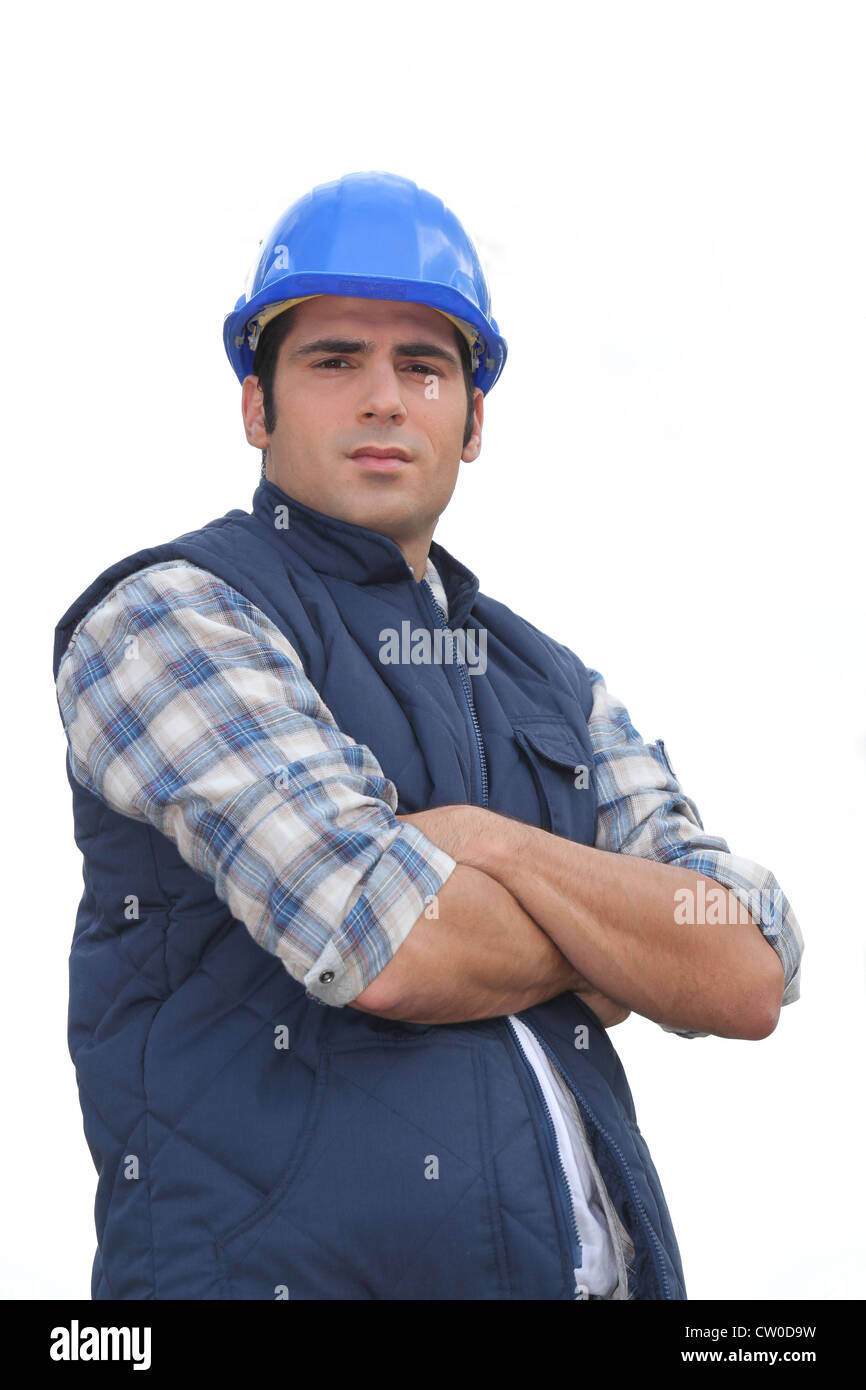 Portrait of a standoffish tradesman with his arms crossed Stock Photo