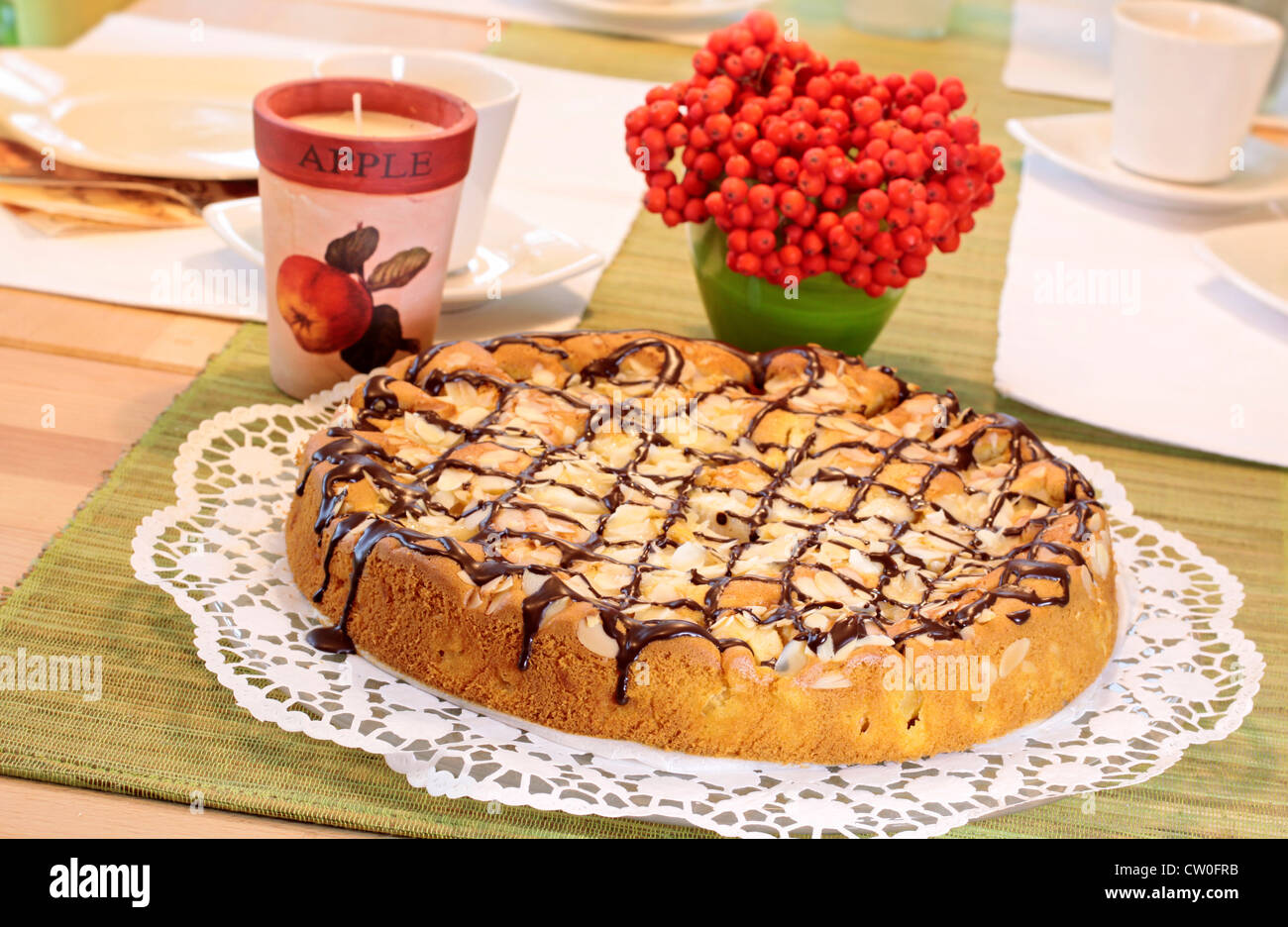 Apple cake on beautifully decorated tea table Stock Photo