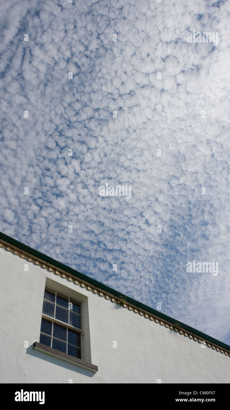 Mackerel sky above lighthouse at Blackhead, Northern Ireland Stock