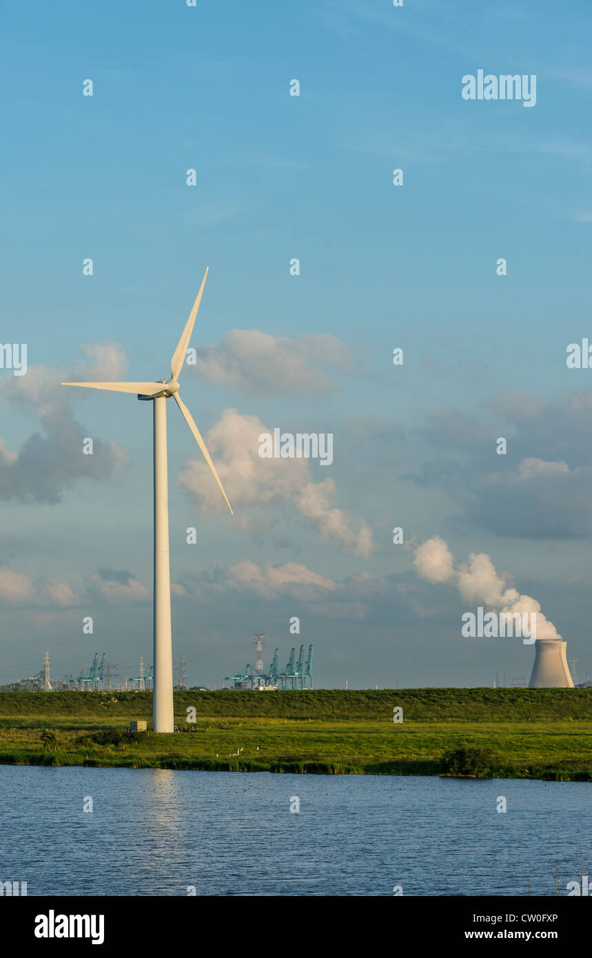 Wind turbine with nuclear smokestack Stock Photo