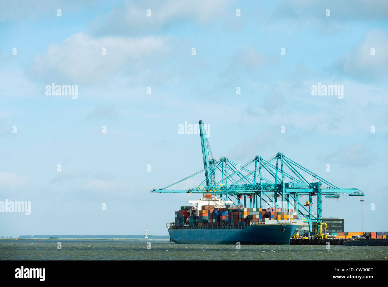 Container ship docked at harbor Stock Photo