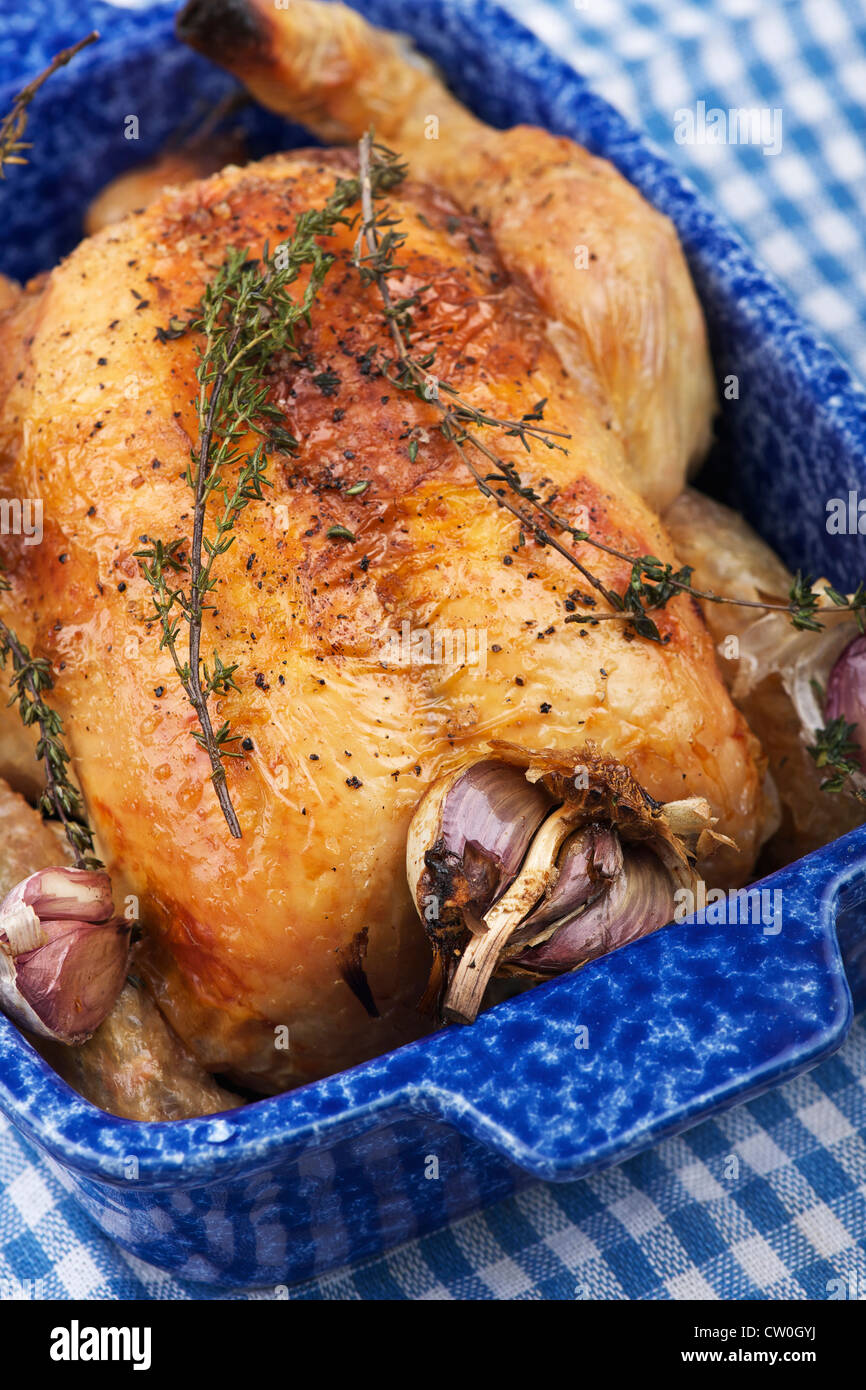 Dish of roast chicken with onions Stock Photo