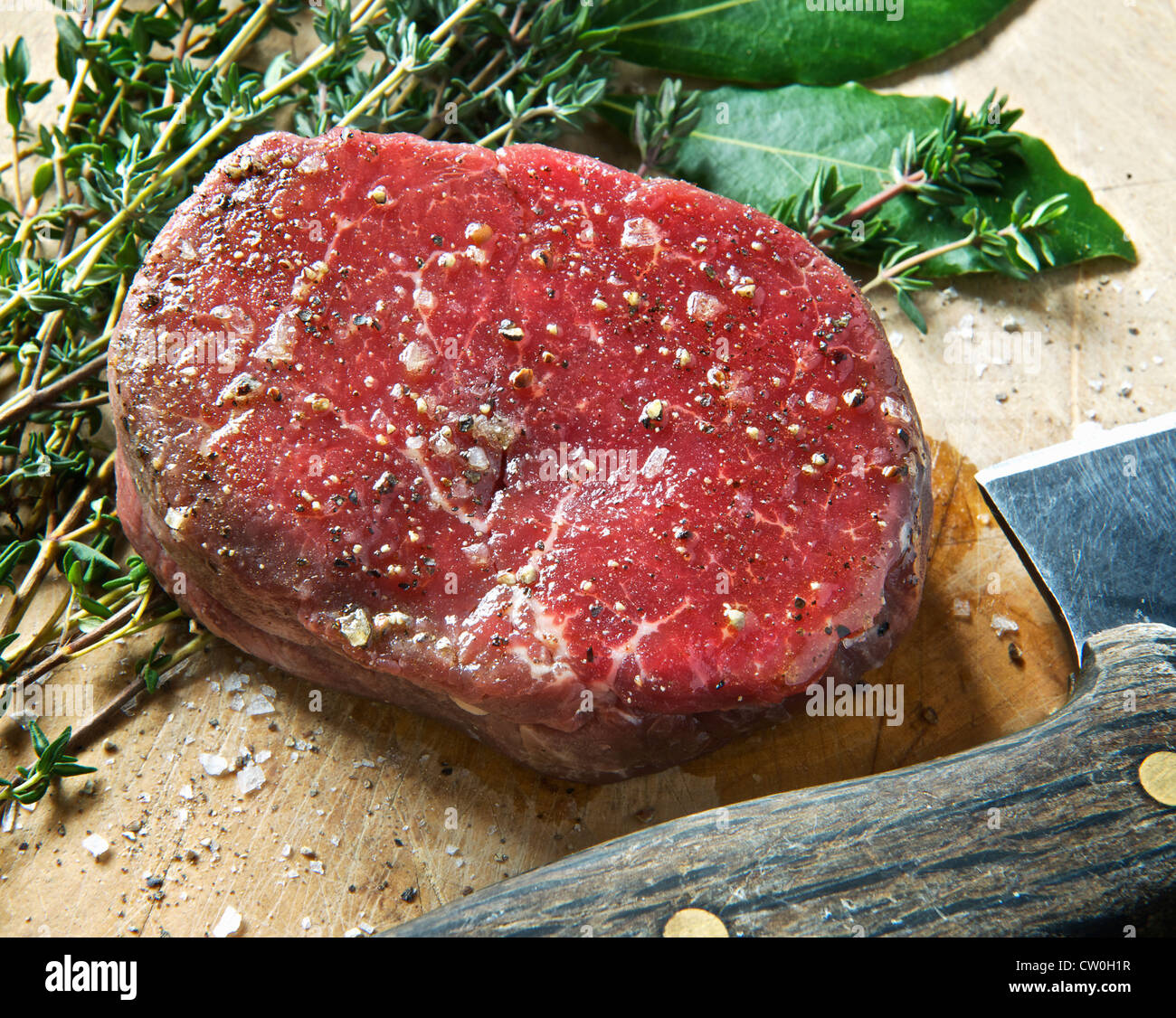 Close up of fillet steak on wooden board Stock Photo