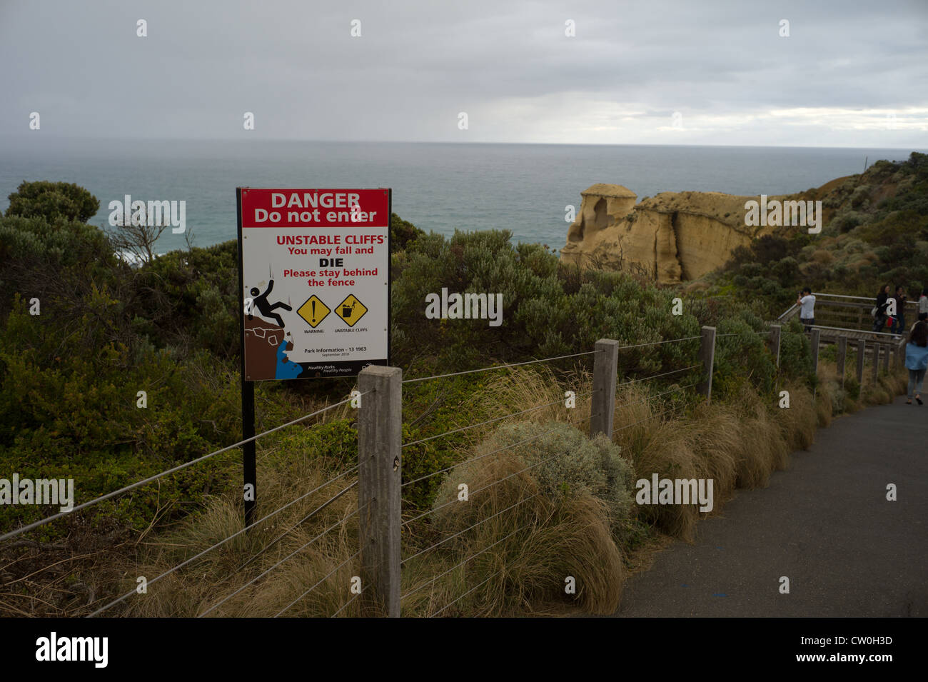 Danger! Sign Warning of Falling Rocks in National Park Great Ocean Road Stock Photo