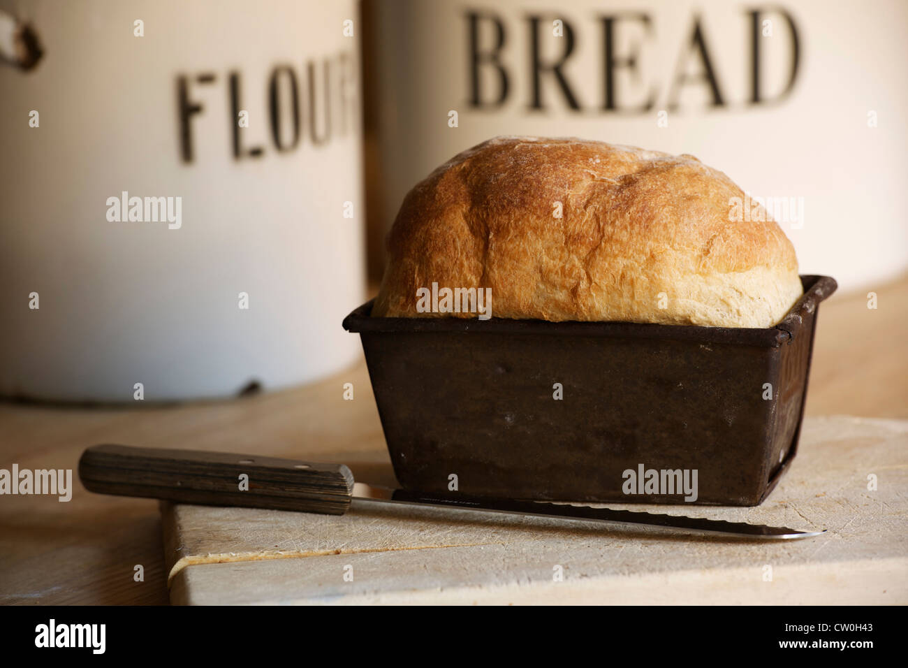 Close up of bread in loaf tin Stock Photo