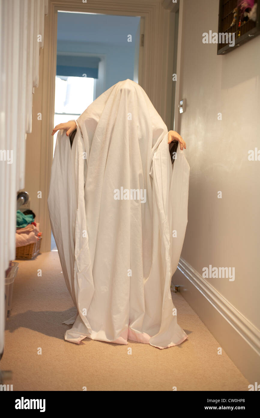 Child wearing ghost Halloween costume Stock Photo - Alamy