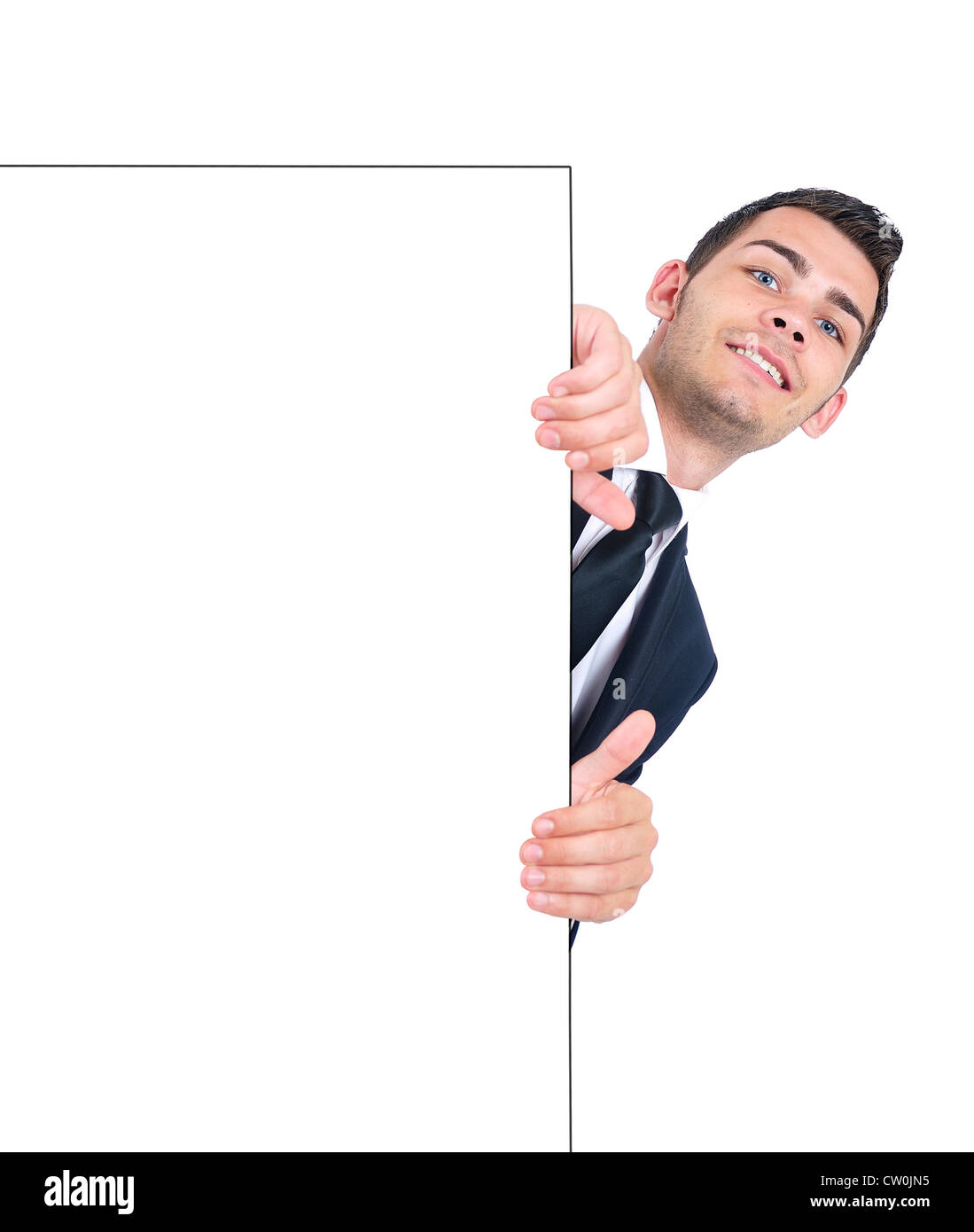 Isolated young business man hiding wall Stock Photo