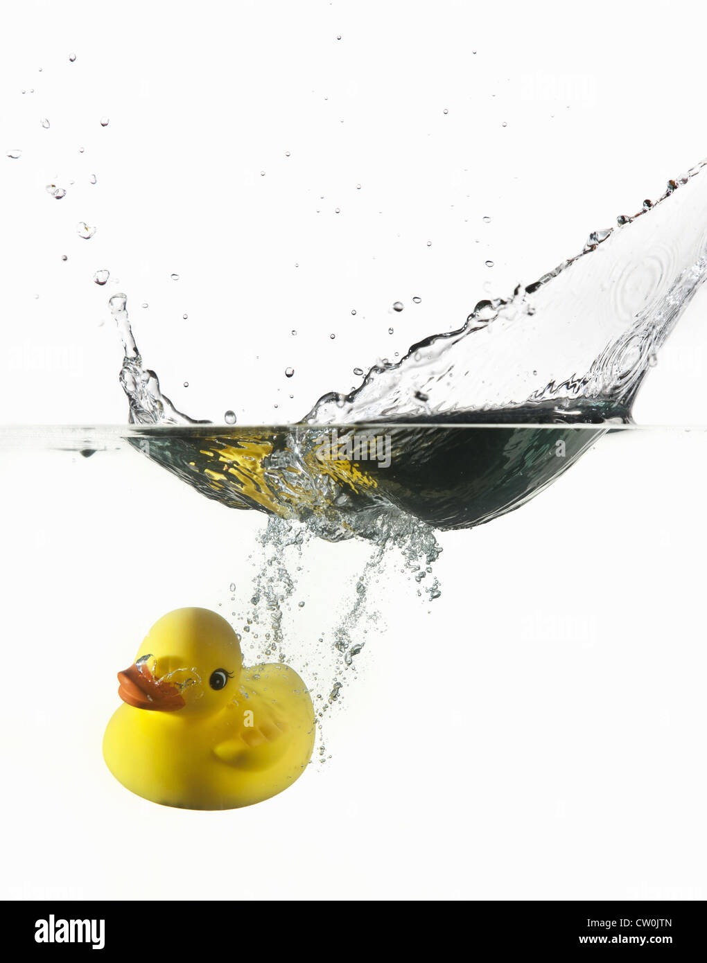Rubber duck plunging into water Stock Photo