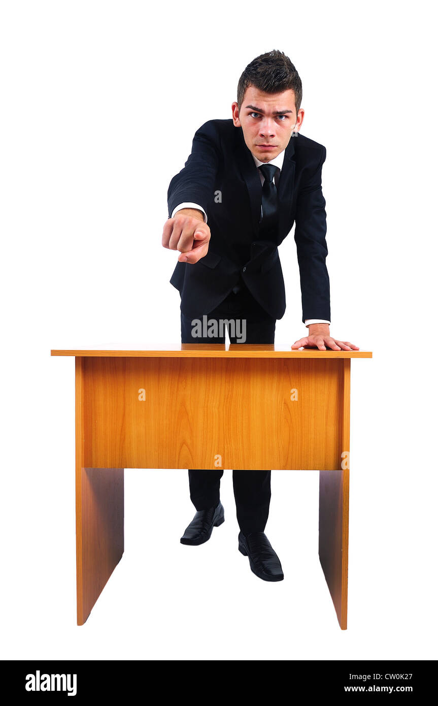 Isolated business man pointing at desk Stock Photo