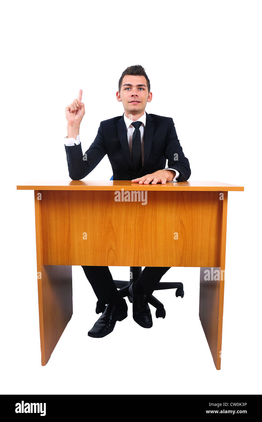 Isolated business man presenting at desk Stock Photo