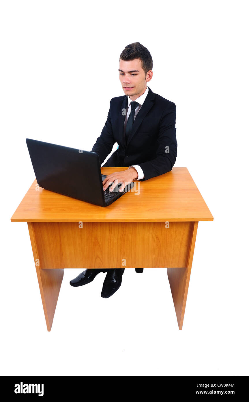 Isolated business man with laptop at desk Stock Photo