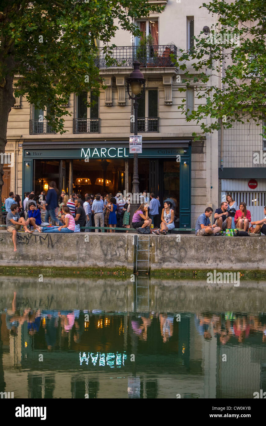 Paris, France, Young People Relaxing in Front of French Bar Bistro Restaurant, 'Marcel' the Canal Saint Martin Area, vintage French quarter, paris water Stock Photo