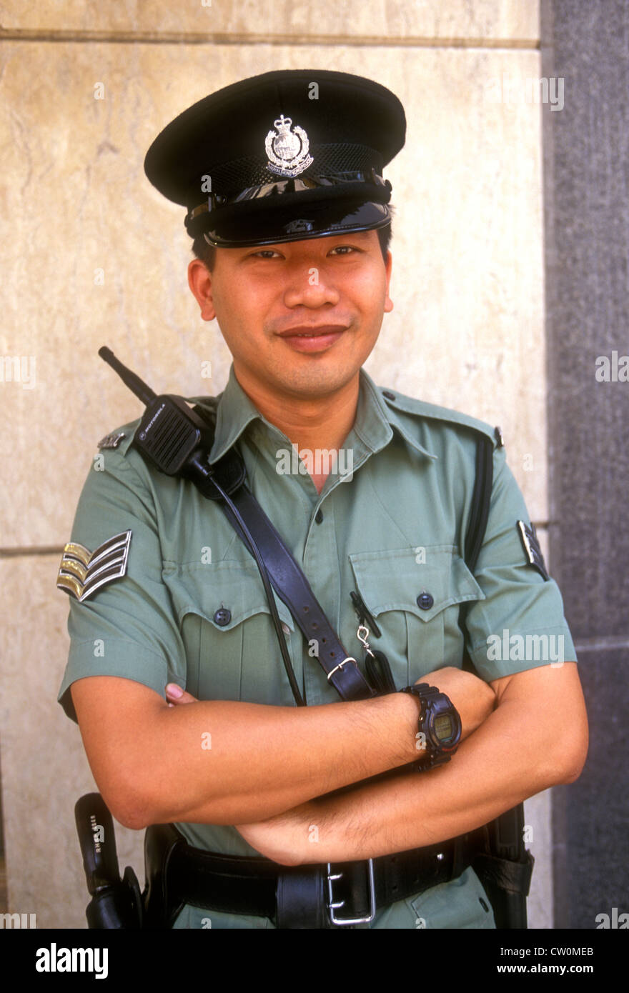 1, one, Chinese man, Chinese policeman, policeman, eye contact, front view, portrait, Royal Hong Kong Police, Hong Kong Island, Hong Kong, China, Asia Stock Photo