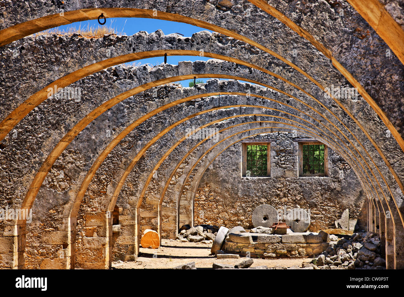 Beautiful arches in the old olive press at Agios Georgios (Saint George) monastery, Karydi, Apokoronas, Chania, Crete, Greece. Stock Photo
