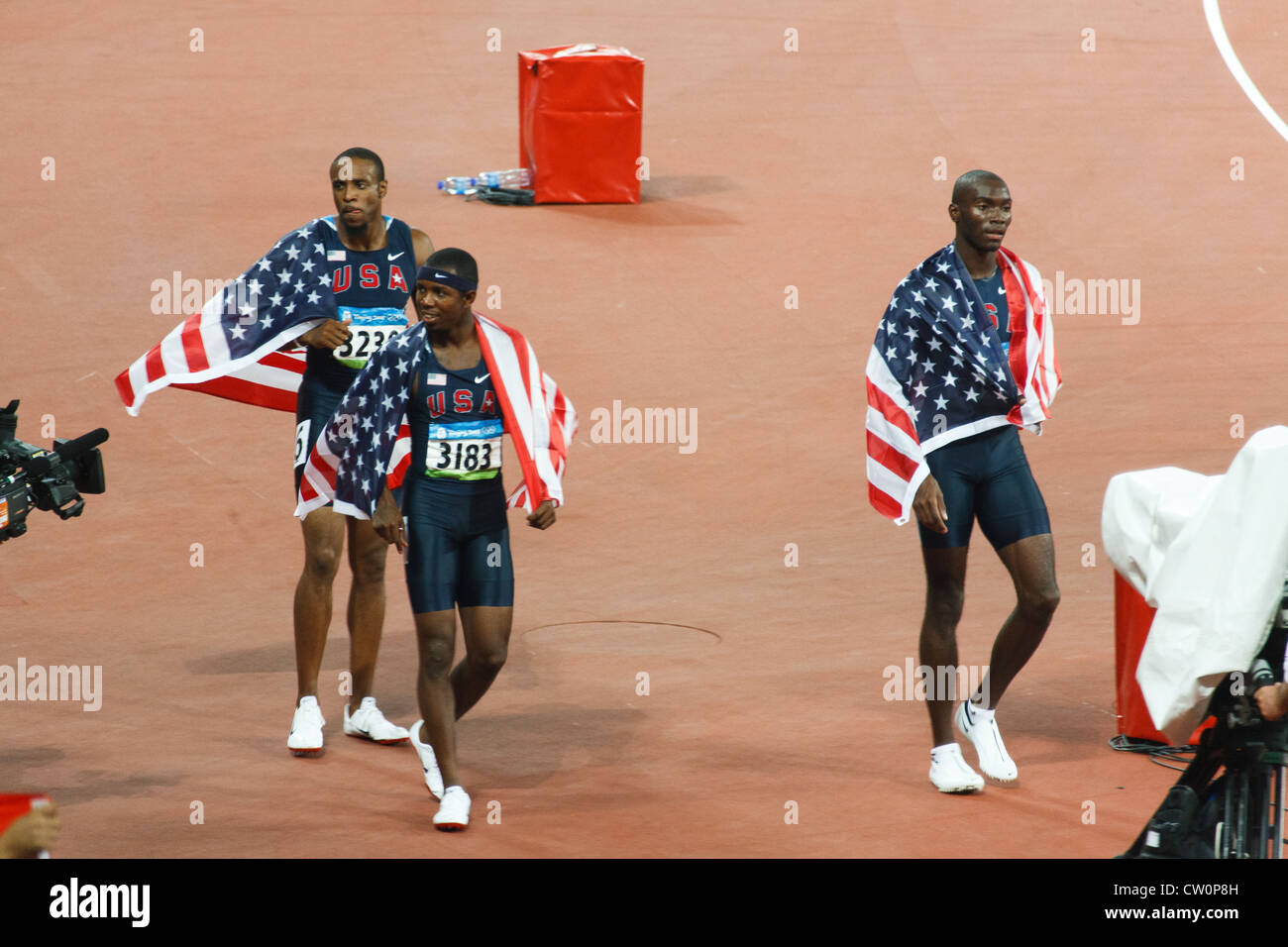 Angelo Taylor Kerron Clement and Bershawn Jackson take a victory lap after USA sweeps men's  400 meter hurdles with all medals Stock Photo