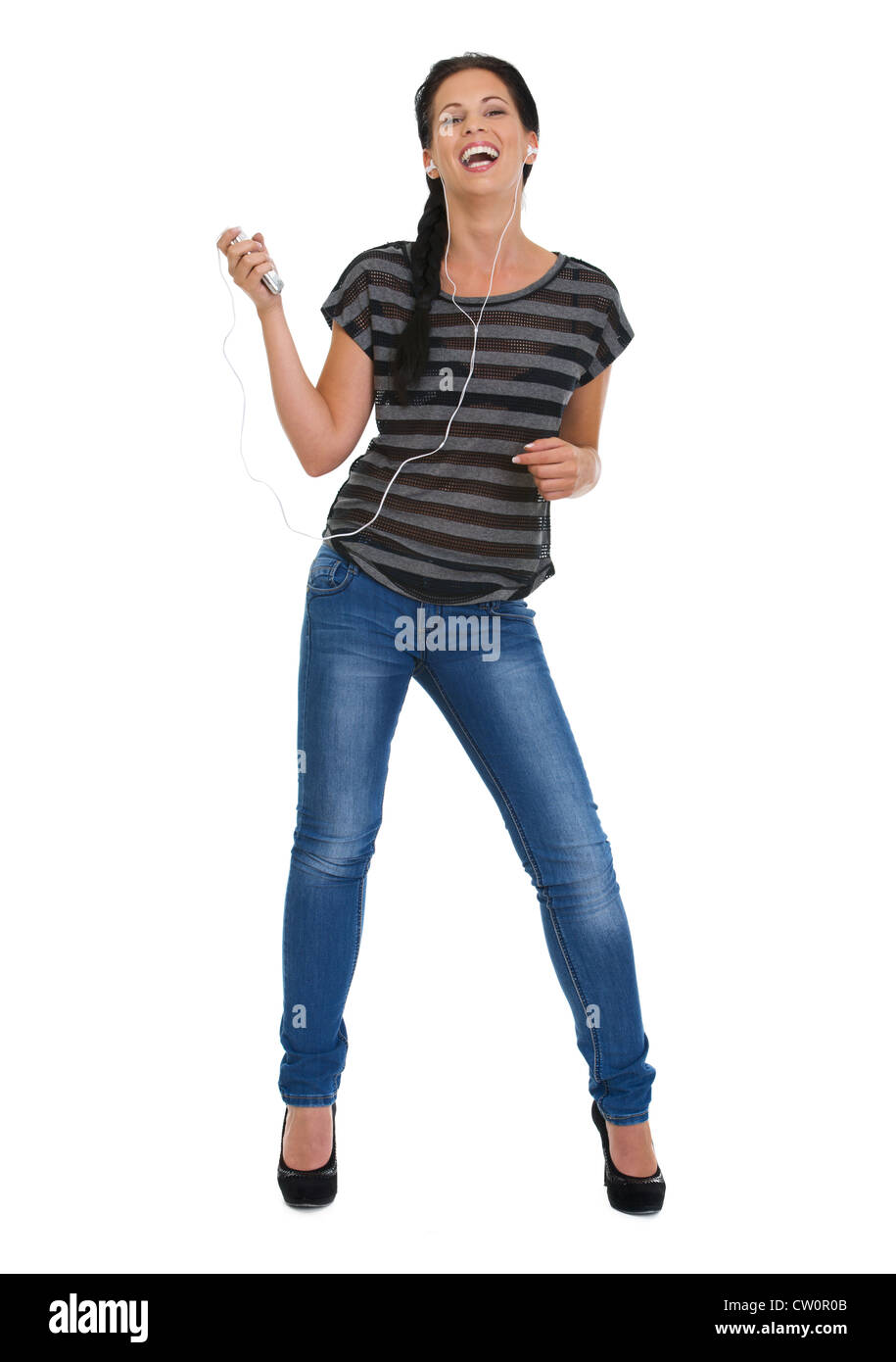 Full length portrait of happy girl with headphones dancing Stock Photo