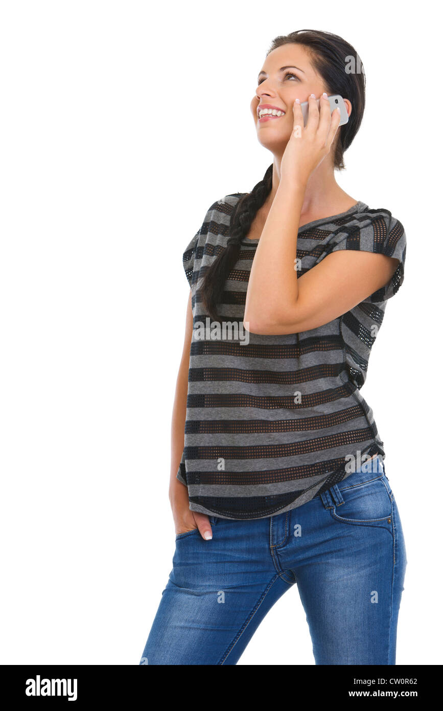 Smiling girl speaking mobile phone and looking on copy space Stock Photo