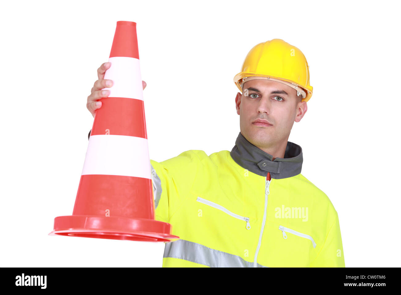 Worker with a traffic cone Stock Photo - Alamy