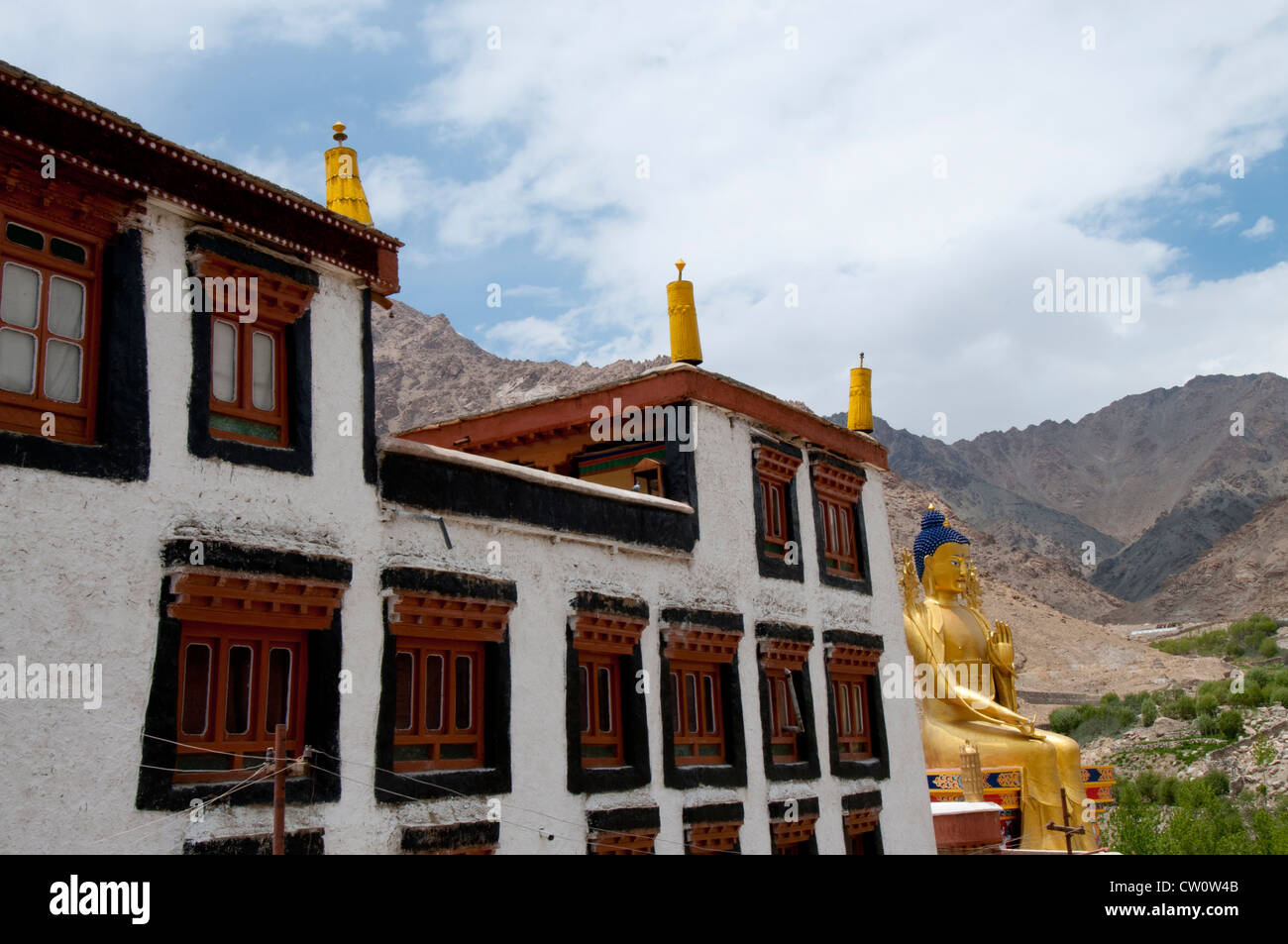 A Likir Monastery building and the 75 foot gold statue of Maitreya in Ladakh, India. Stock Photo