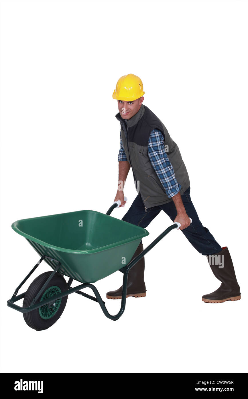 Man with a wheelbarrow Stock Photo Alamy