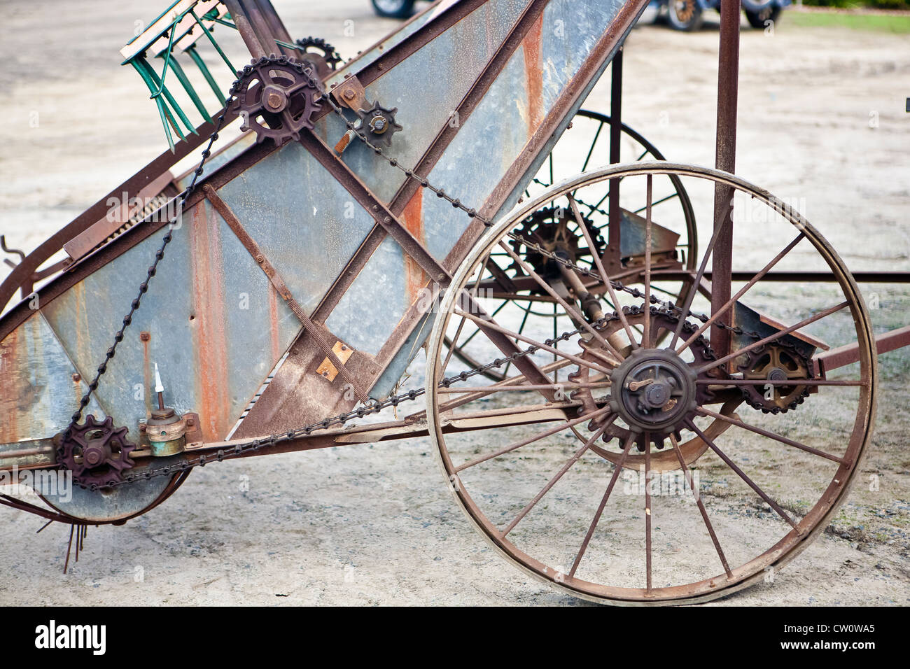 rusty gears and chain drive on antique farm machinery Stock Photo