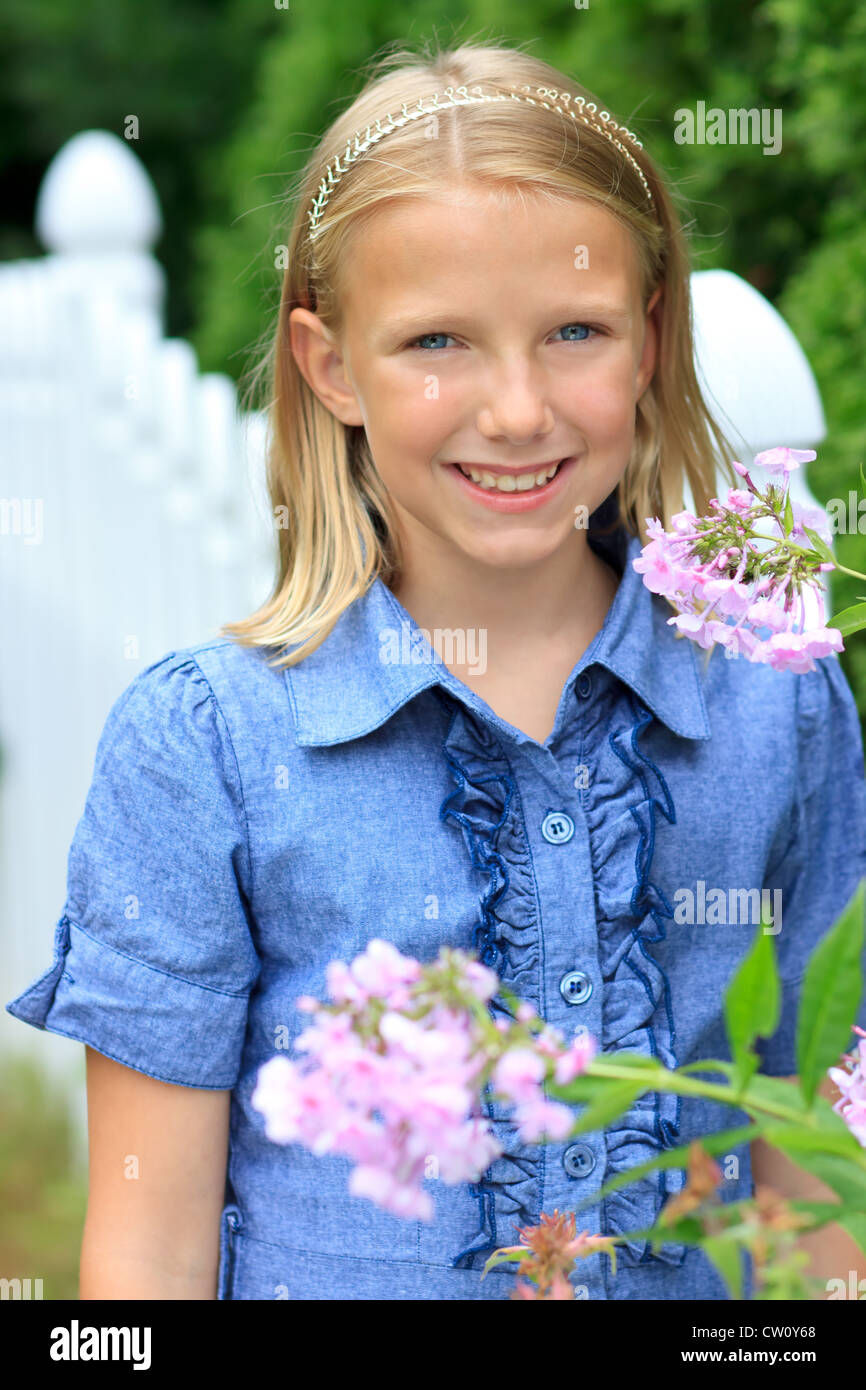 Young Blond Girl Smiling Outside Stock Photo - Alamy