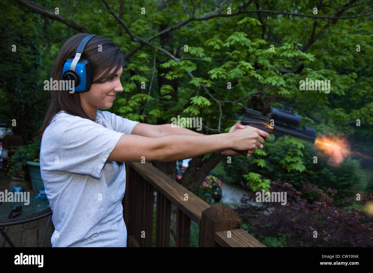 Teenage Girl Shooting a .22 Semi-automatic Pistol Stock Photo