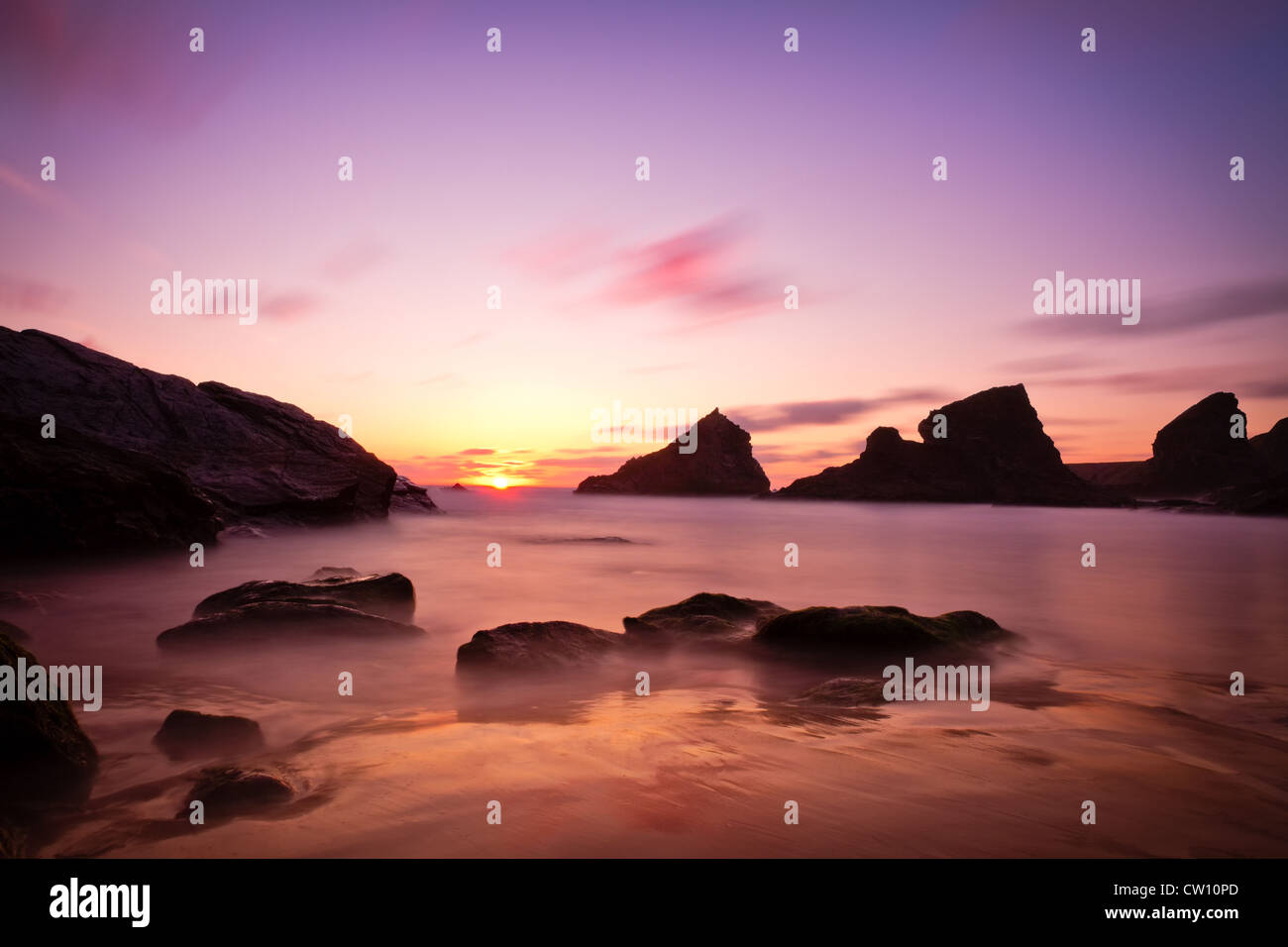 Bedruthan Steps at sunset with violet skies, Cornwall, England Stock