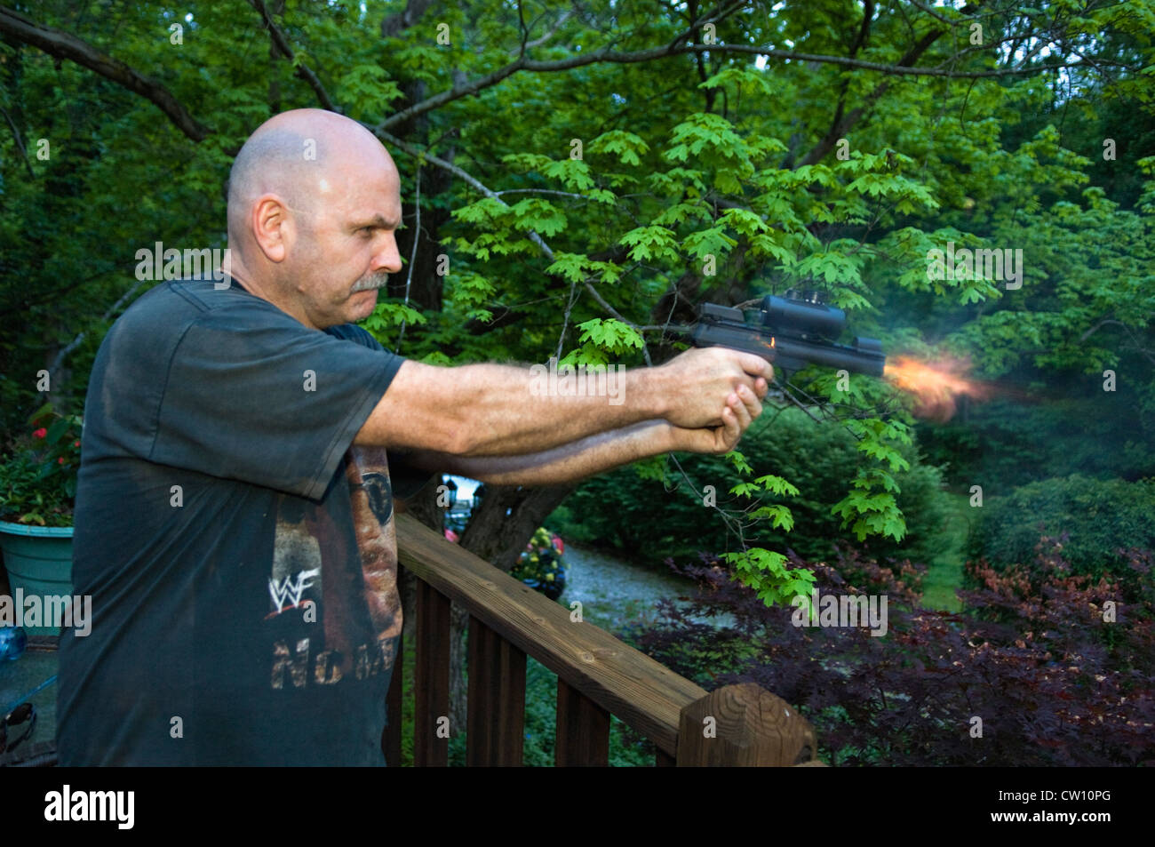 Man Shooting a .22 Semi-automatic Pistol Stock Photo
