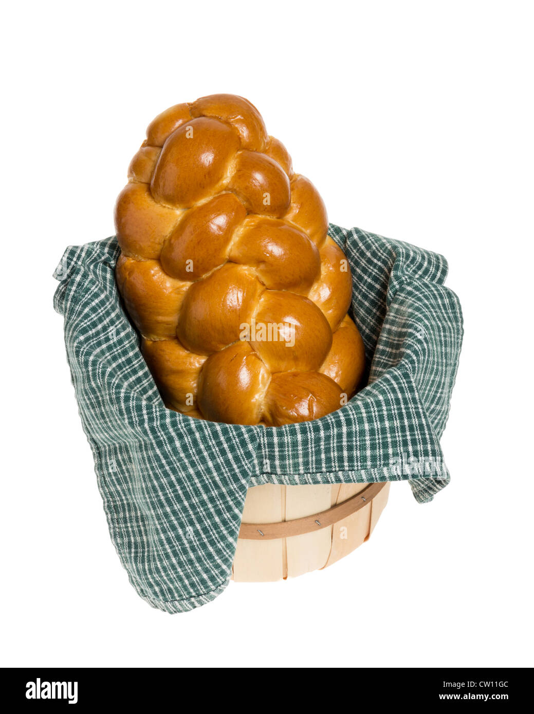 Challah bread in wicker basket with green cloth Stock Photo