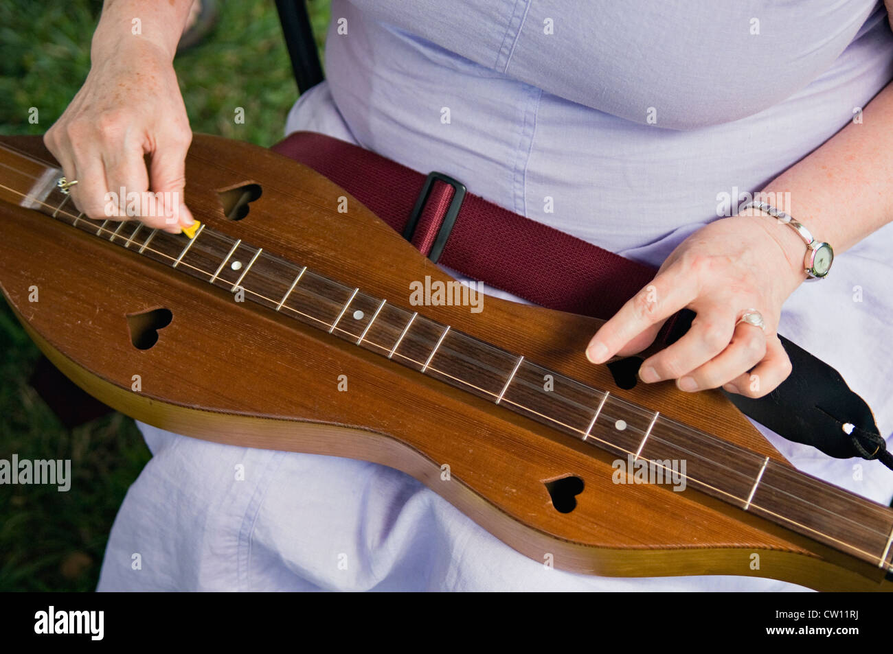 Close-up of Woman Playing Appalachian Dulcimer at the Kentucky Music Festival in Louisville, Kentucky Stock Photo