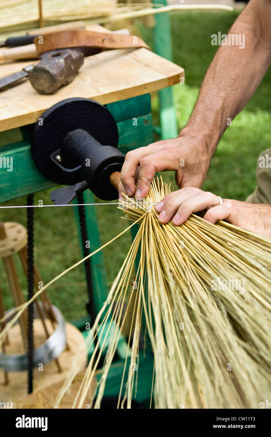Craftsman Making a Broom using Old Time Techniques at the Kentucky Music Weekend in Louisville, Kentucky Stock Photo