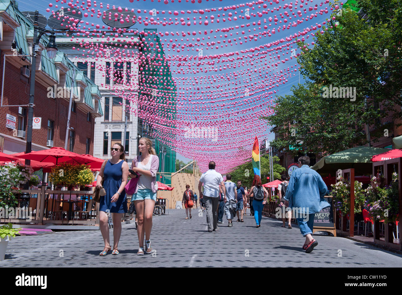 Pedestrians on a part Ste Catherine street which is closed to automobiles during summer months. Gay Village, Montreal. Stock Photo