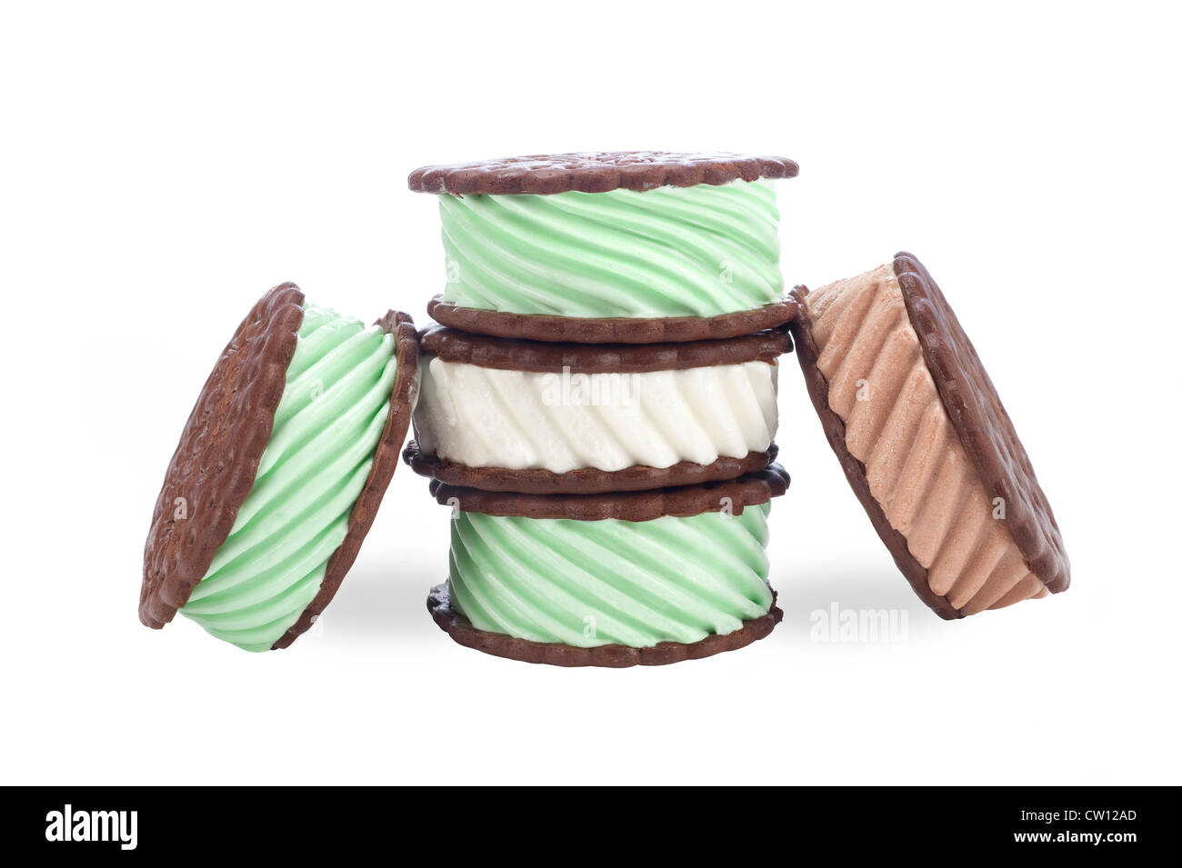 A collection of chocolate, vanilla and mint ice cream sandwiches on a white background. Stock Photo