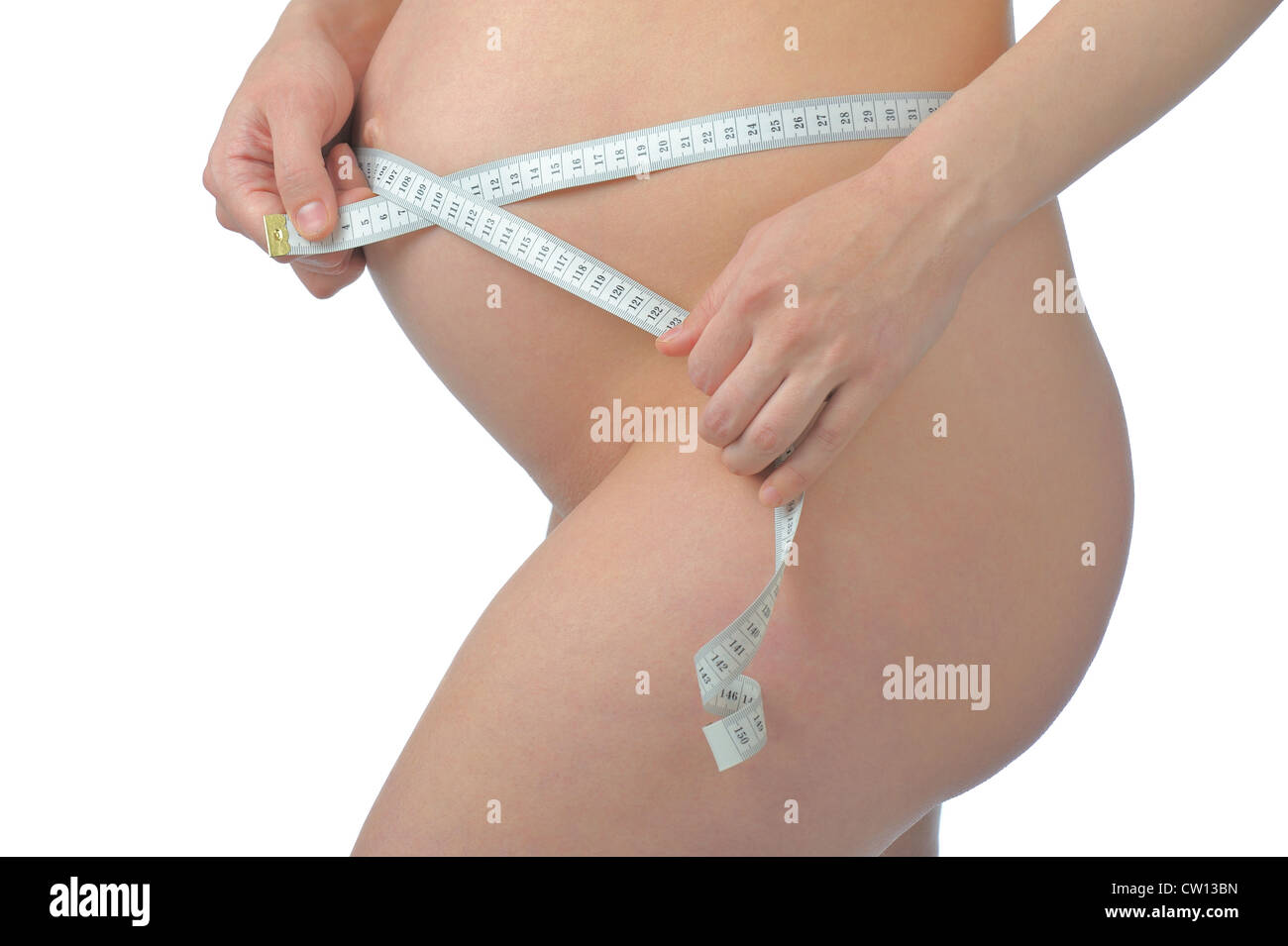Pregnant woman with sewing meter and pretty belly Stock Photo