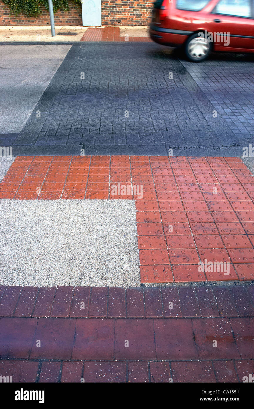 Road marking with feature for blind people at pedestrian crossing. UK
