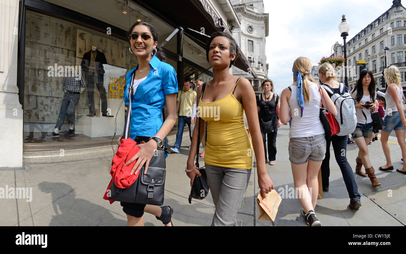 London, England, UK. Girls walking down Regent Street Stock Photo Alamy