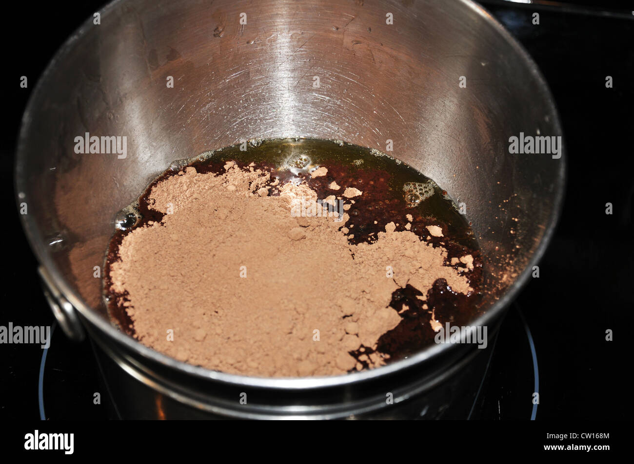 Homemade Chocolate Melting Cocoa Butter And Mixing In Cocoa Powder Stock Photo Alamy