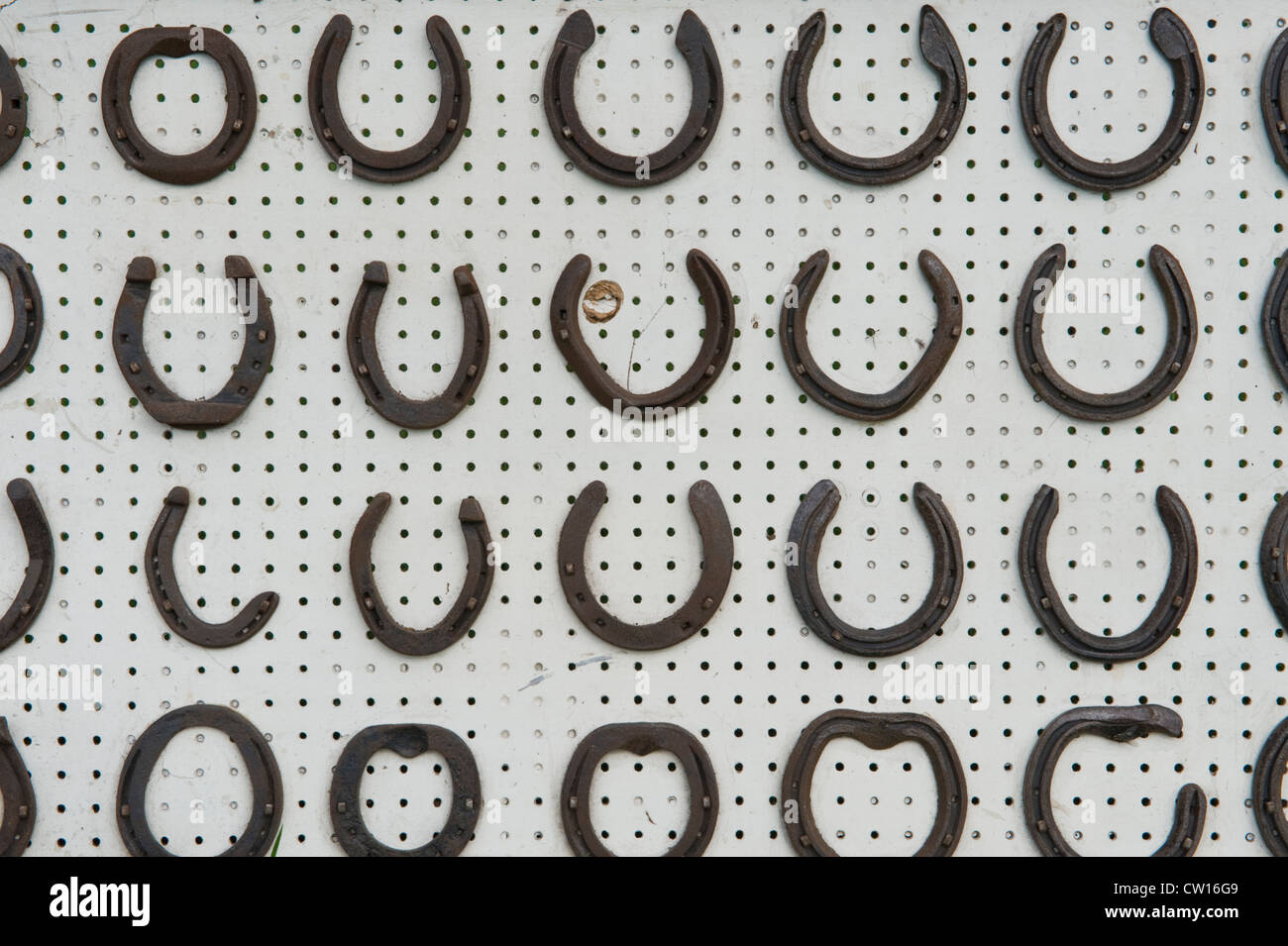Selection of horse shoes of various types and sizes on display at