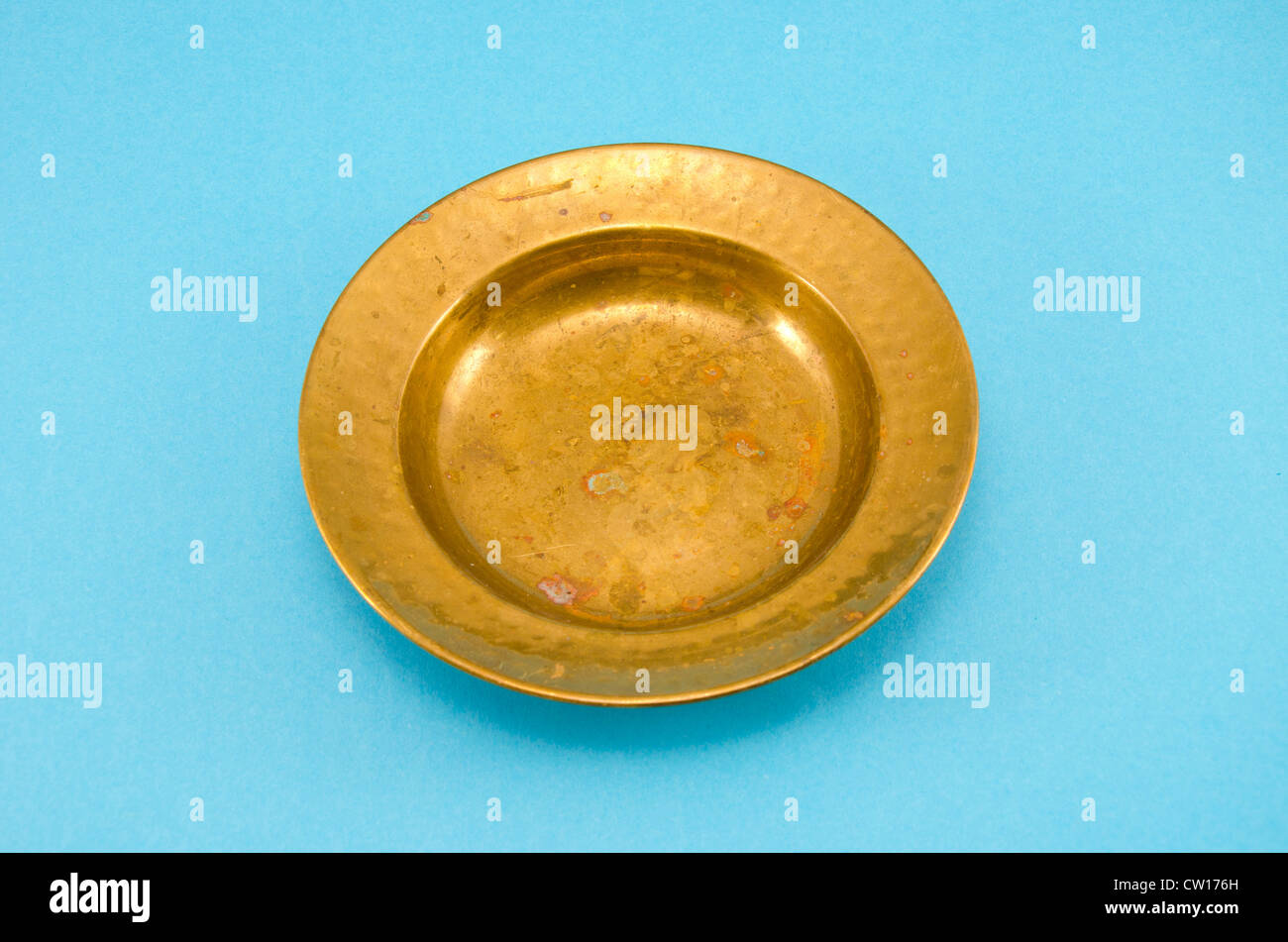 ancient and empty brass plate on azure background Stock Photo Alamy