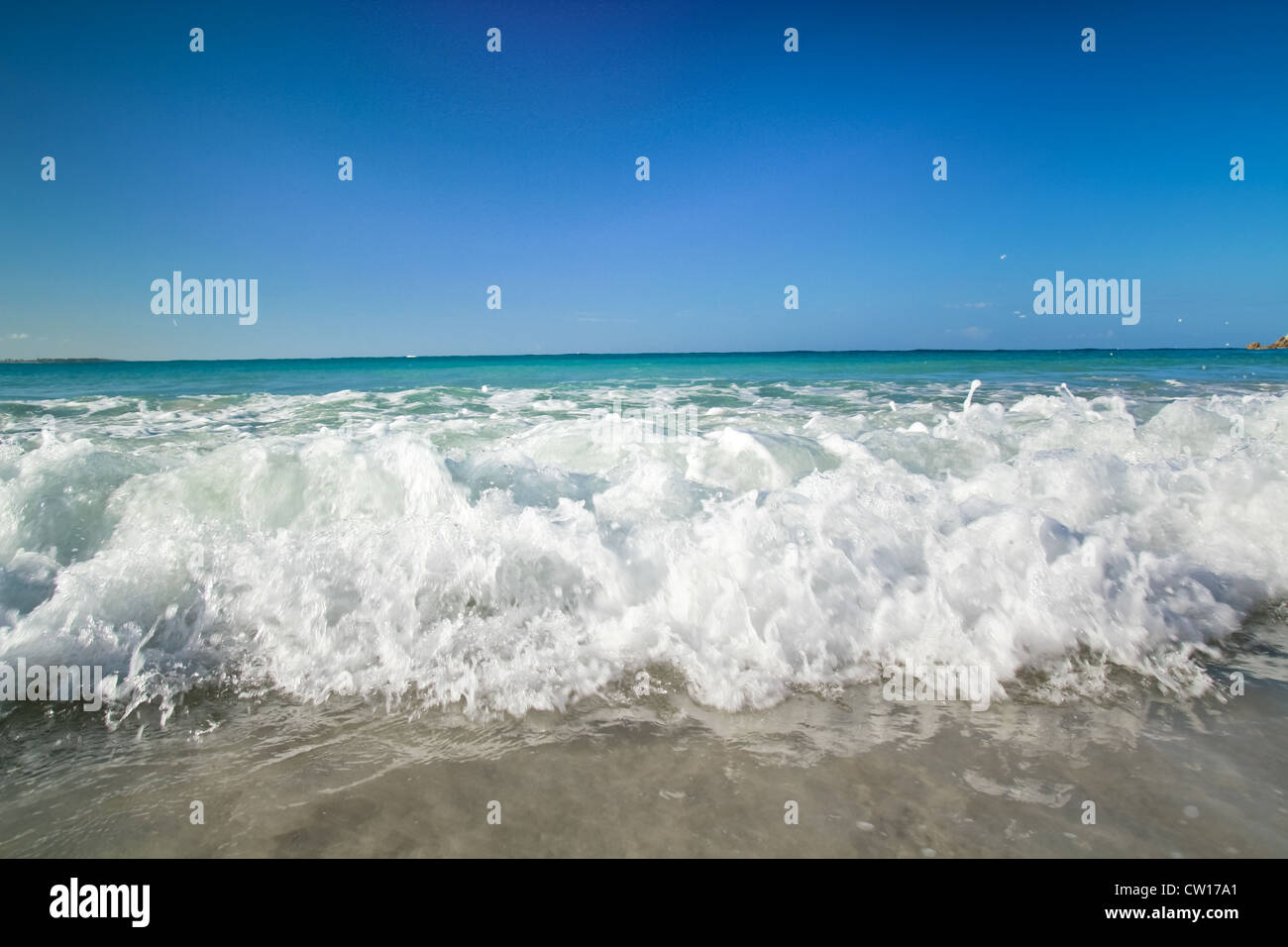 Tropical beach of Atlantic ocean with big waves, caribbean Stock Photo