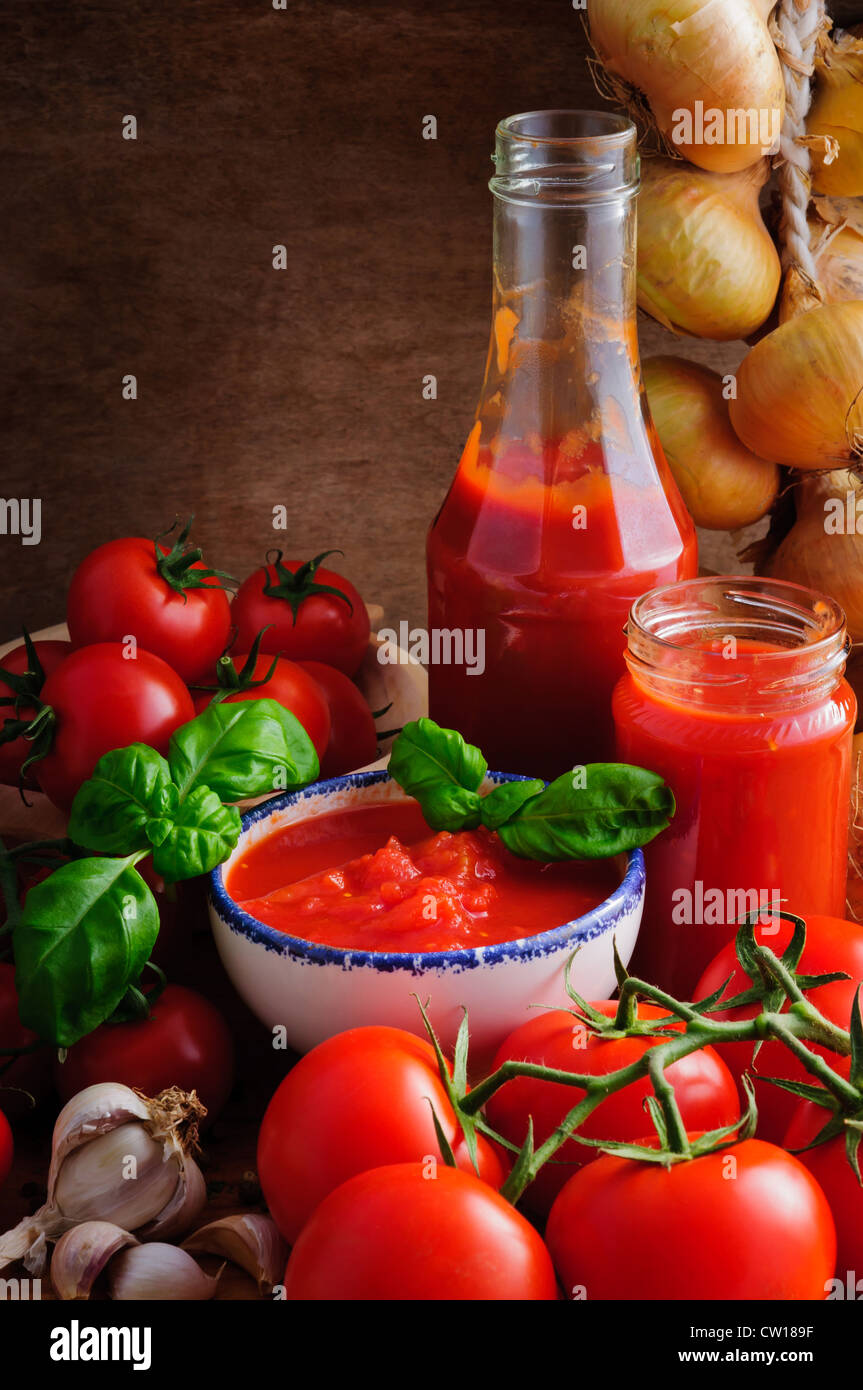 Still life with traditional homemade tomato sauce and ingredients Stock Photo