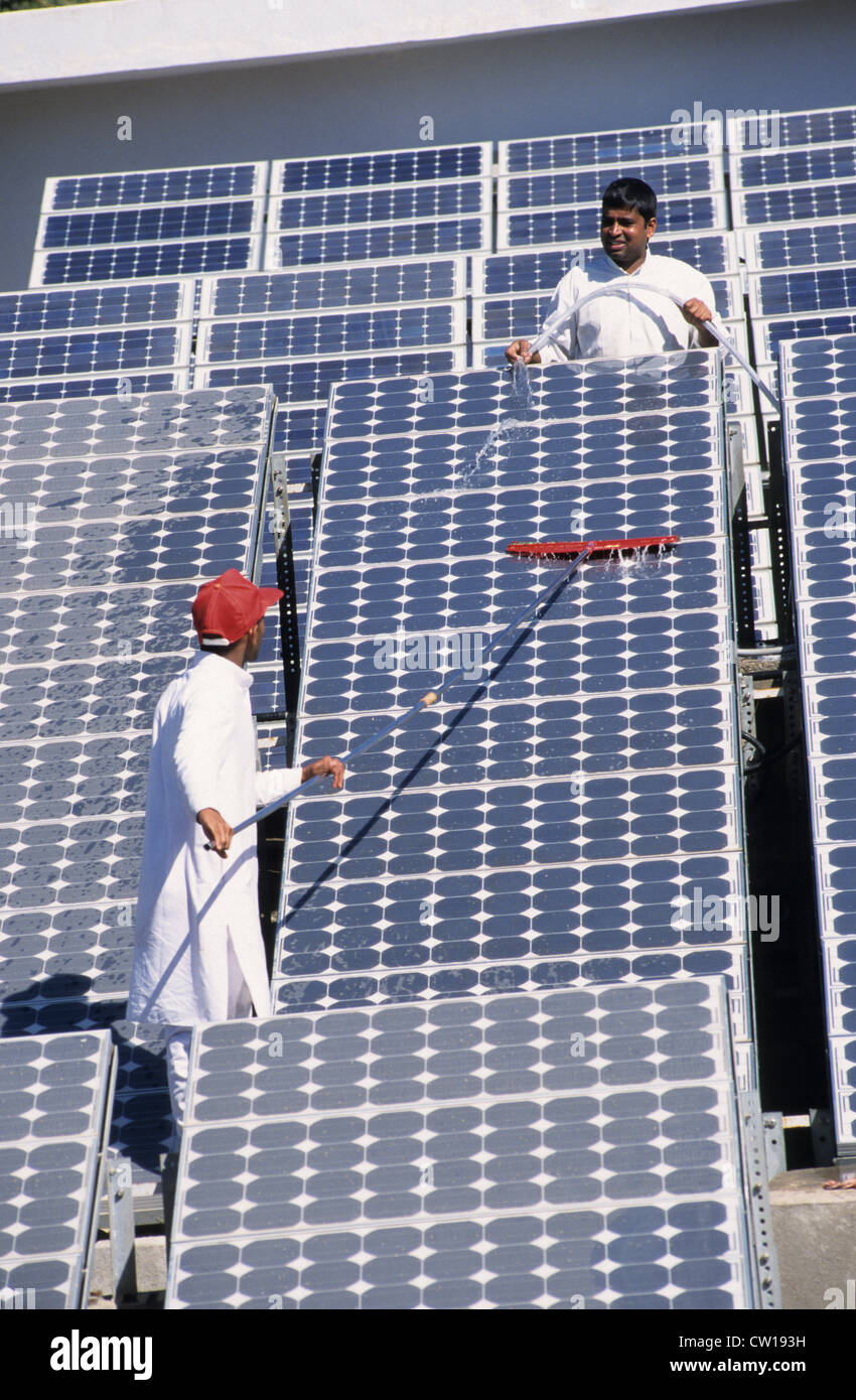 INDIA , photovoltaic system at Brahma Kumari Ashram in Mount Abu, cleaning of solar panels Stock Photo