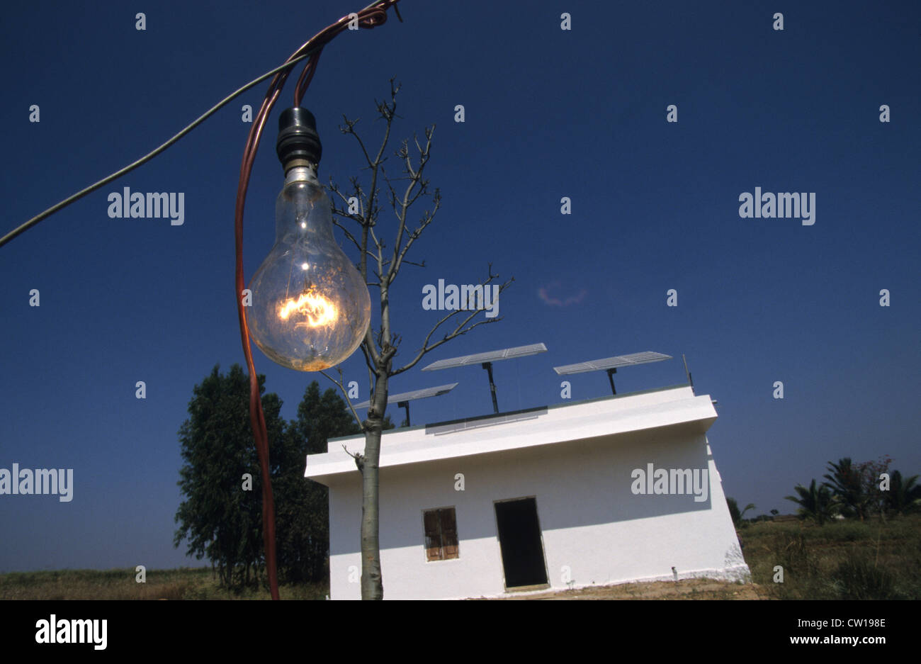 INDIA light bulb with solar power supply from Photovoltaic panel at farm near Bangalore Stock Photo