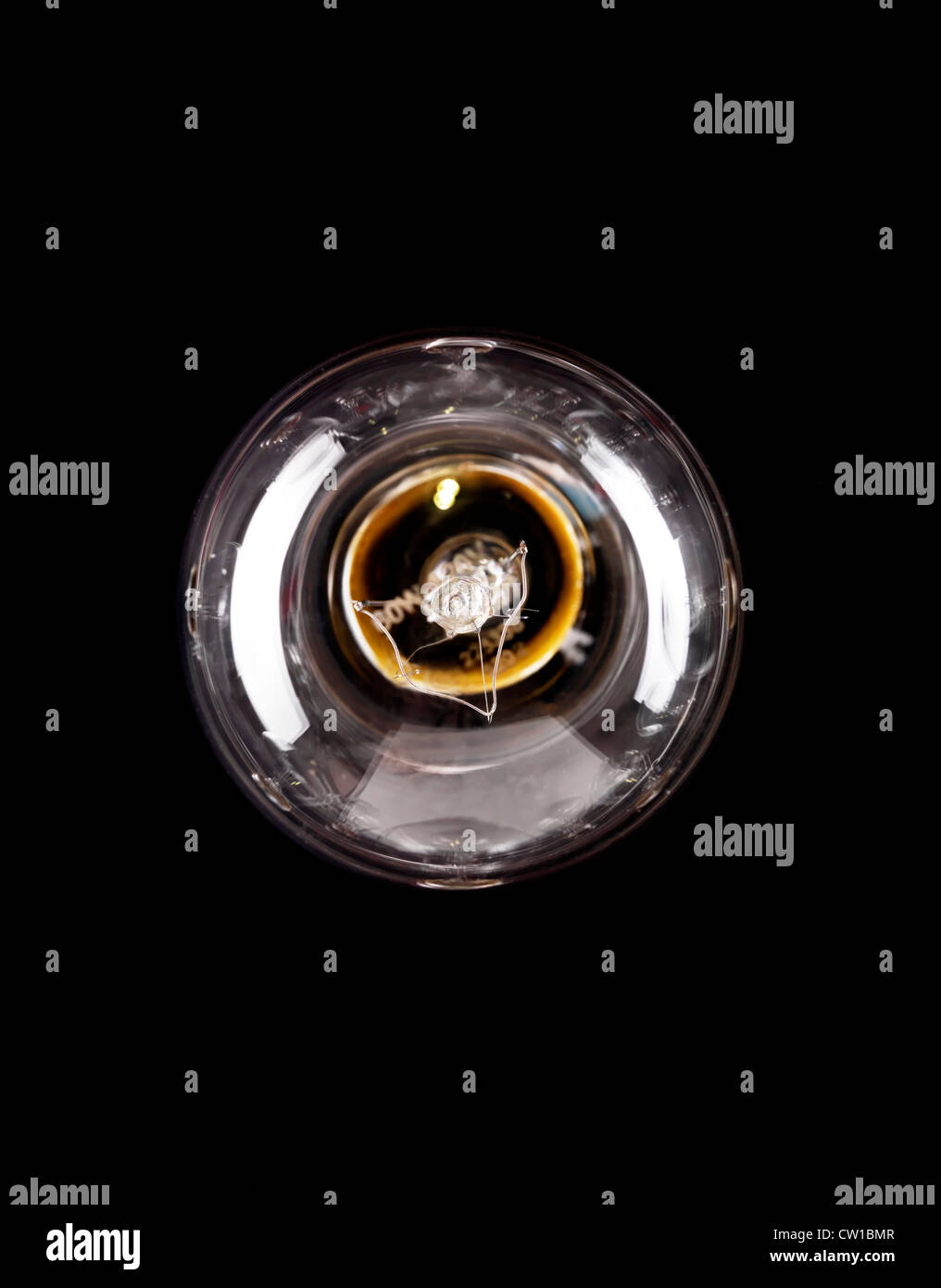 Single incandescent tungsten light bulb turned off isolated on black