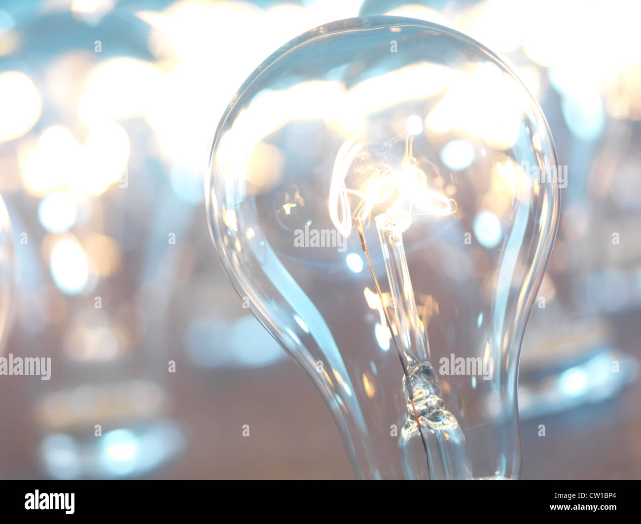 Closeup of lit up incandescent light bulbs. Power consumption concept